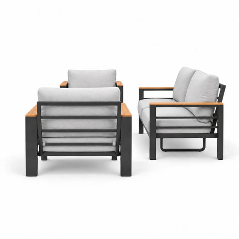 Side view of loveseat, two armchairs, and coffee table