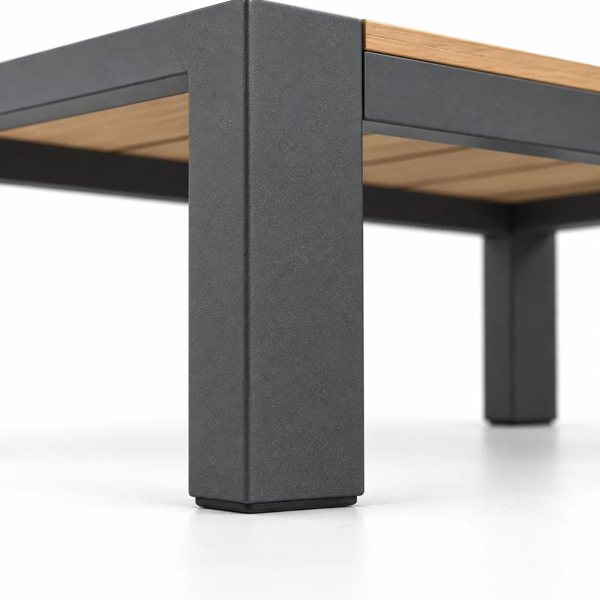 Powder-coated aluminum leg and foot detail on outdoor patio coffee table