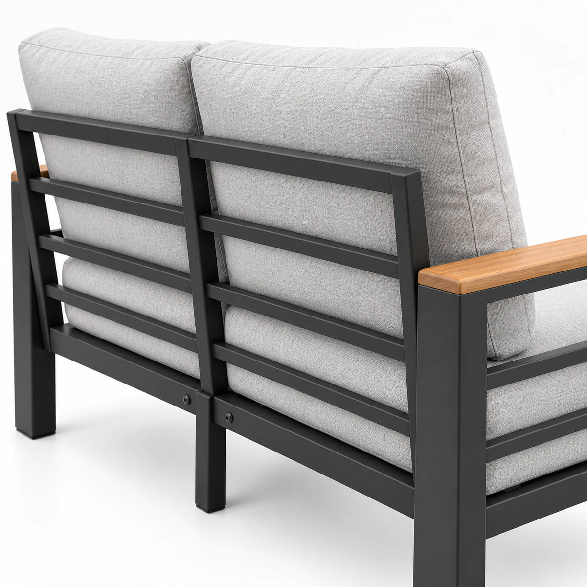 Rear view of an outdoor aluminum patio loveseat with light gray cushions and dark gray aluminum frame